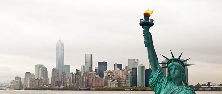 The Statue of Liberty in front of the skyline of New York City