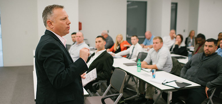 Instructor speaking to a classroom