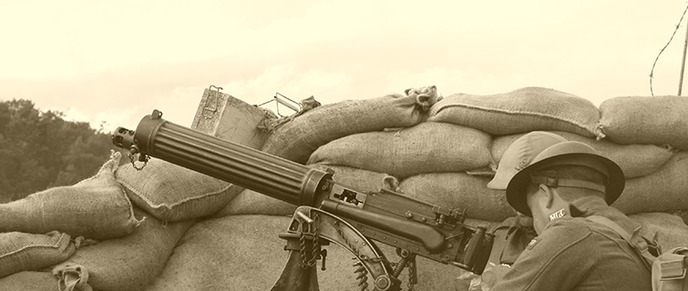 soldier in trench with machine gun