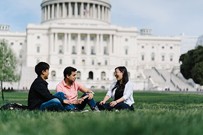 Students having a conversation on the U.S. Capital lawn
